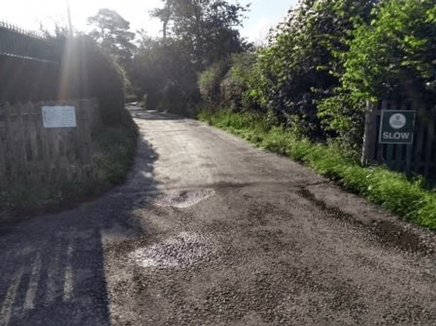 sign on farm drive.png